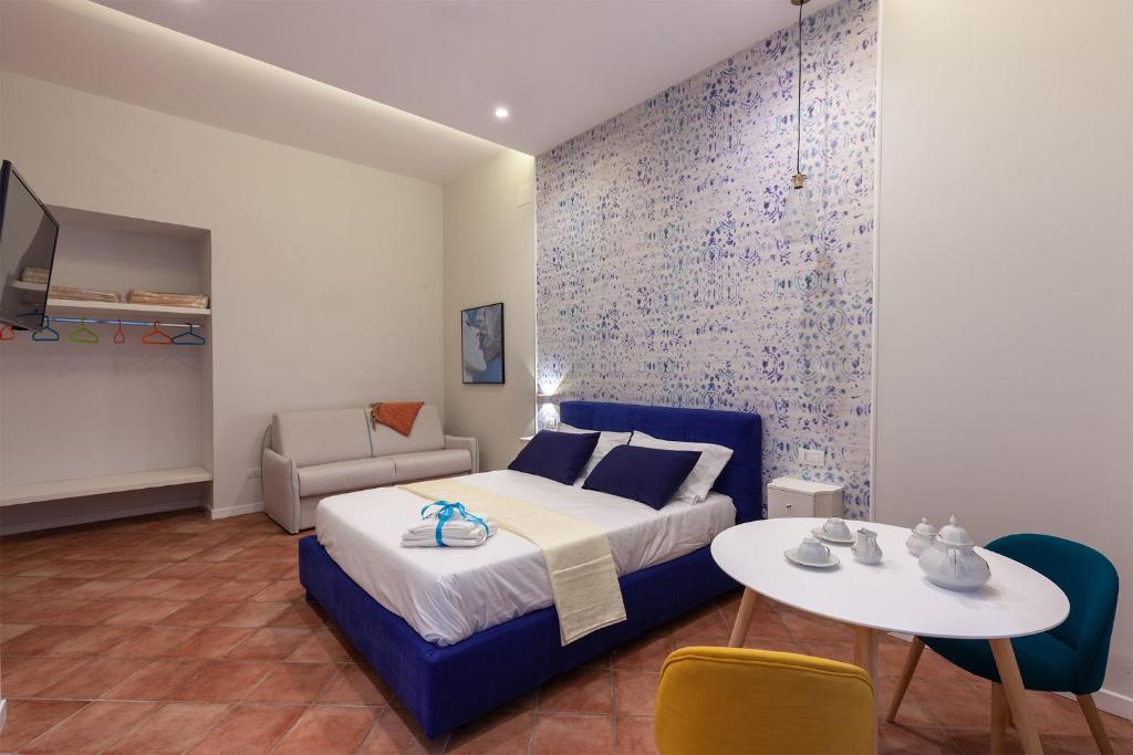A bed or beds in a room at Mythos Holidays