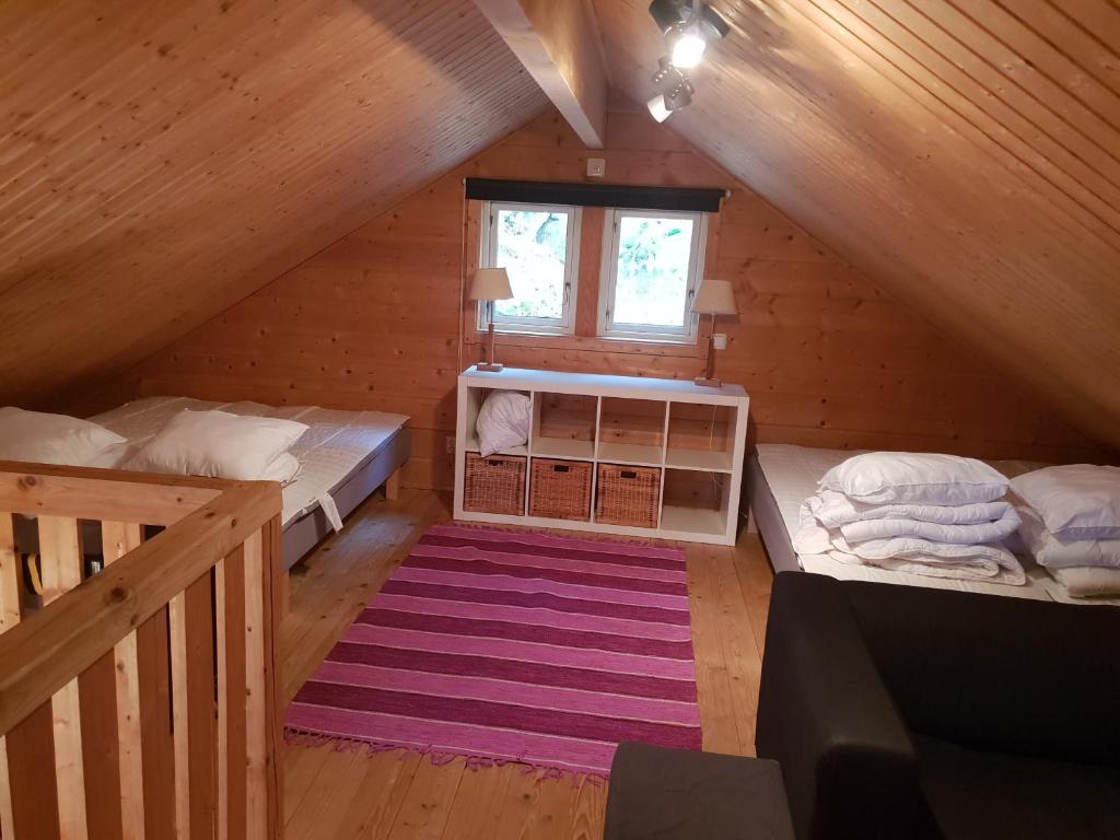 Postel nebo postele na pokoji v ubytování Örnatorpet Ullared