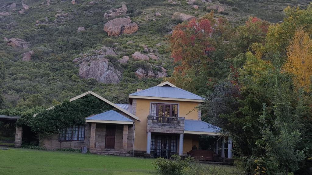 a house in front of a mountain at His Vessel Guesthouse Clarens FS in Clarens