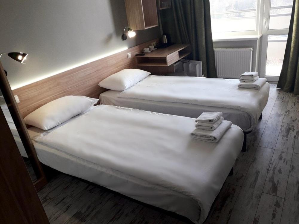 Postel nebo postele na pokoji v ubytování Hotel Vesna