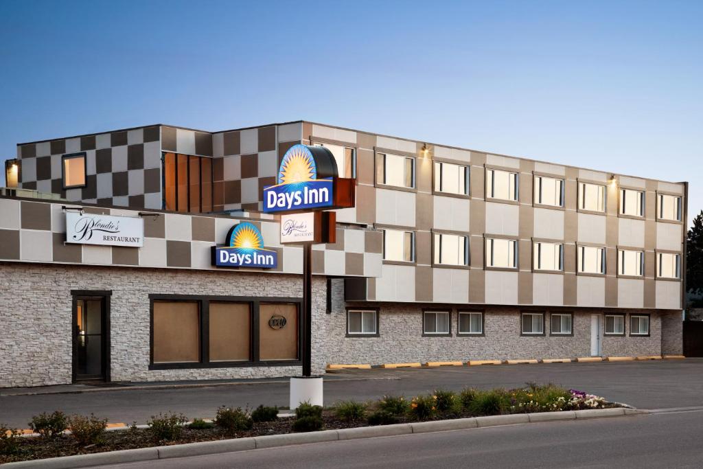 a rendering of a building with a donut shop at Days Inn by Wyndham Sylvan Lake in Sylvan Lake