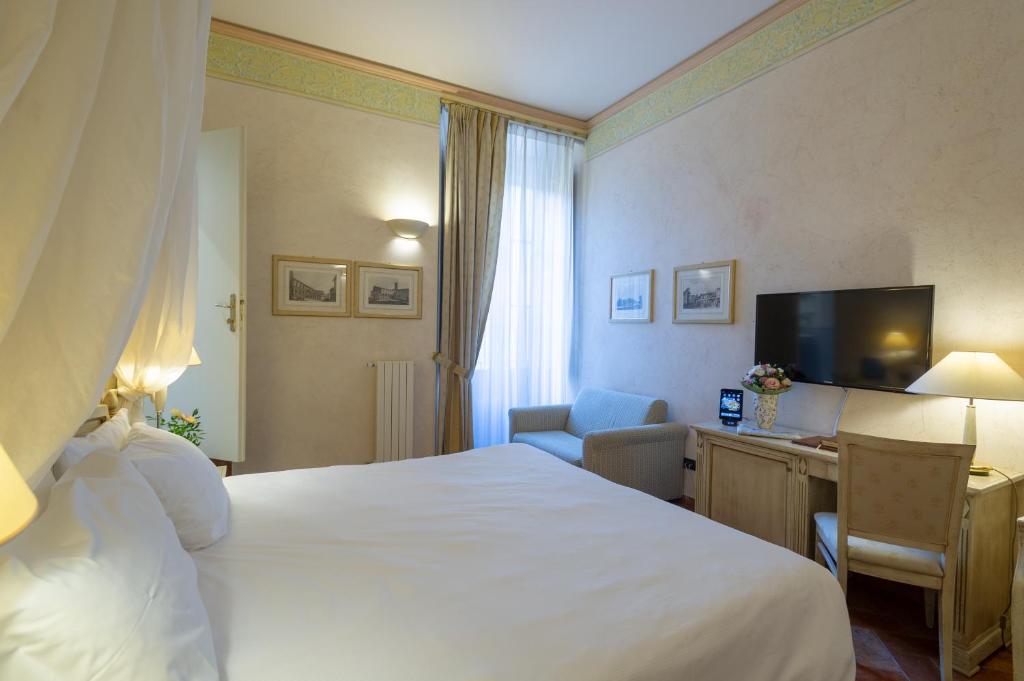 Postel nebo postele na pokoji v ubytování Hotel Davanzati