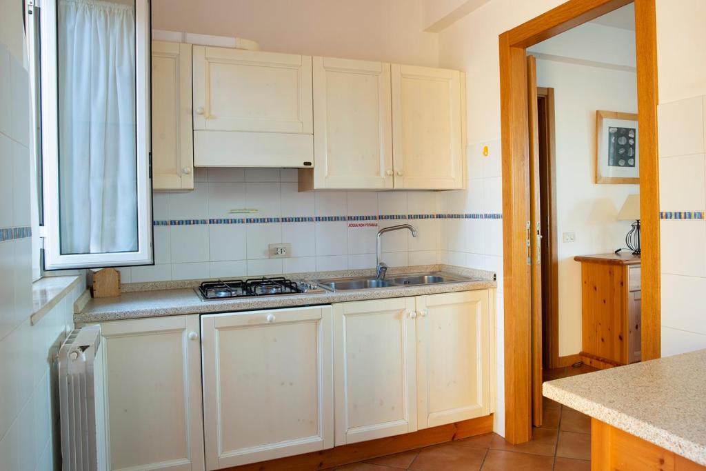 Kuchyňa alebo kuchynka v ubytovaní Residenza Turistico Alberghiera Le Poste del Pianone
