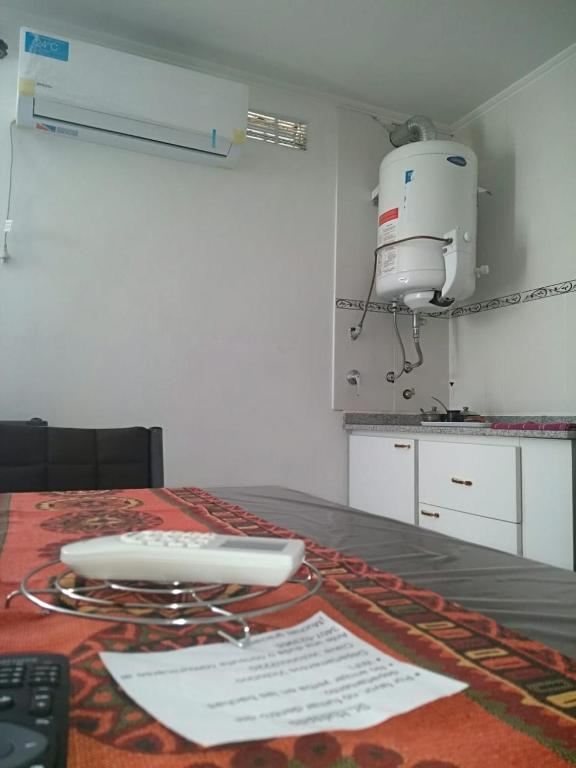 Una cocina o kitchenette en Departamentos Victorino