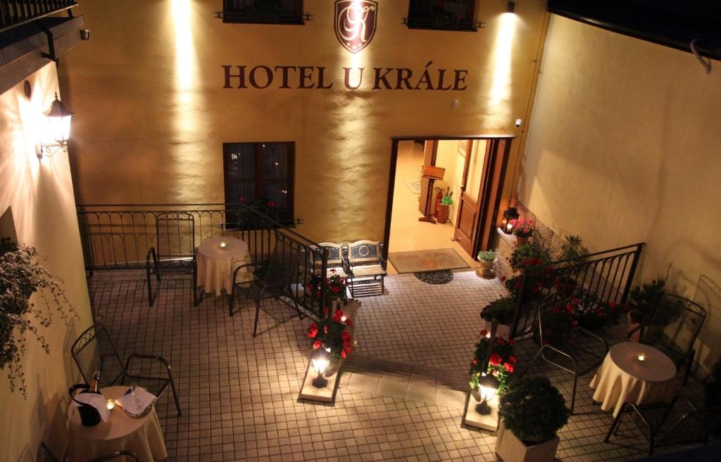 a restaurant with tables and chairs and christmas decorations at Hotel U Krále in Jičín