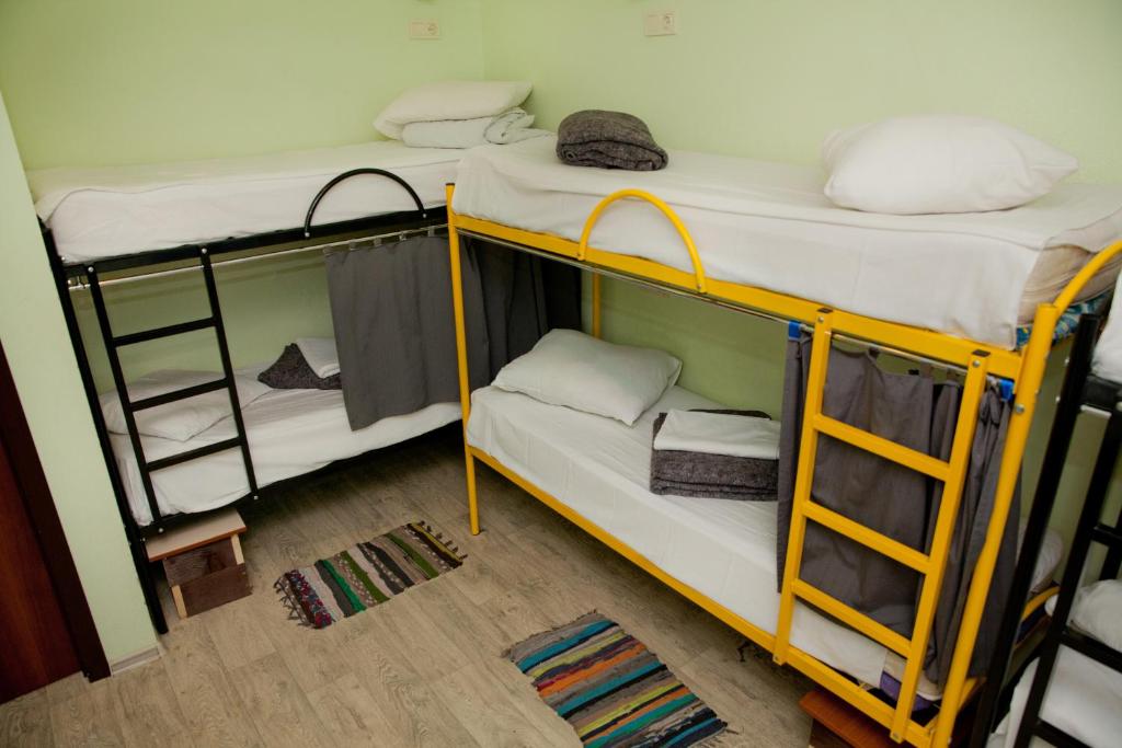 Postel nebo postele na pokoji v ubytování Capsularhouse Hostel