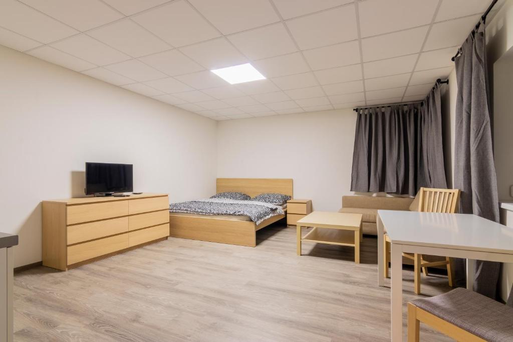 Postel nebo postele na pokoji v ubytování Aparthotel DKS