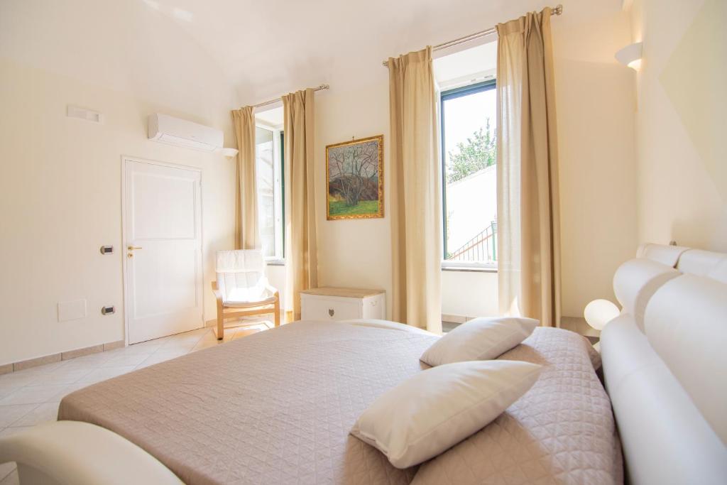 A bed or beds in a room at Casa Ester