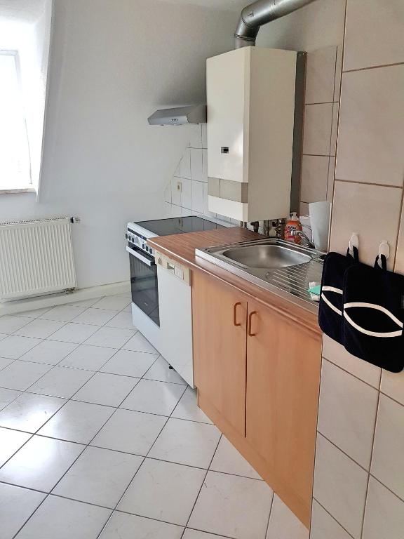 Kuchyň nebo kuchyňský kout v ubytování Ferienwohnung "Alte Fleischerei" Freiberg Sachsen