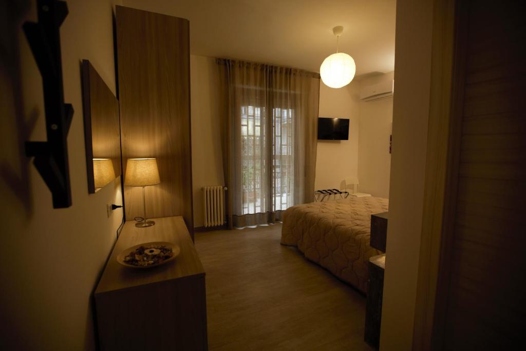 Postel nebo postele na pokoji v ubytování PHALANTHOS TARANTO