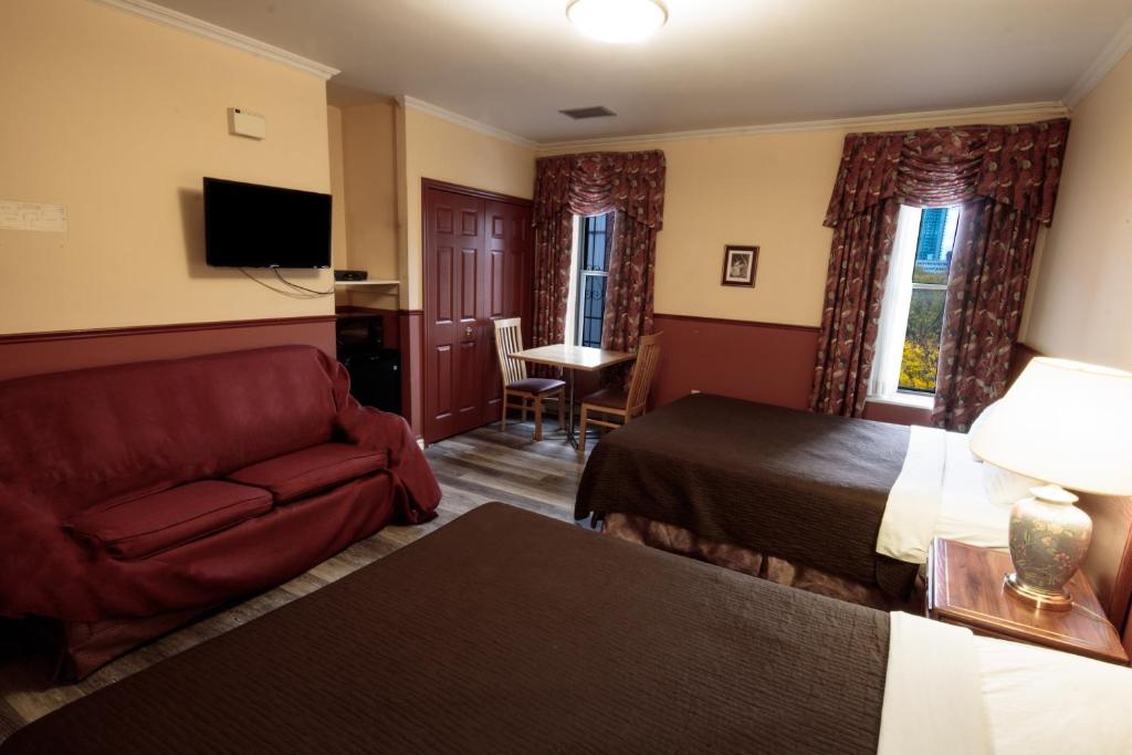 TV a/nebo společenská místnost v ubytování Hotel Casa Bella