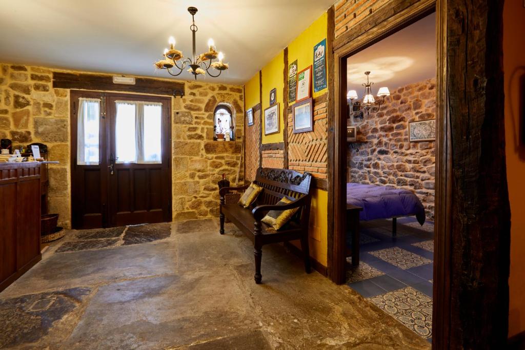 a hallway with a room with a bed and a door at Posada Rural Ochohermanas in Las Fraguas