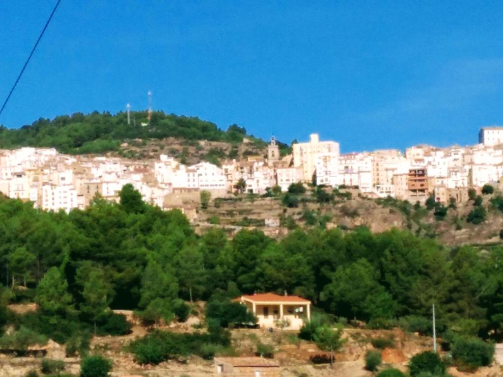 a city on top of a hill with white buildings at Casa Elina I I in Lucena del Cid