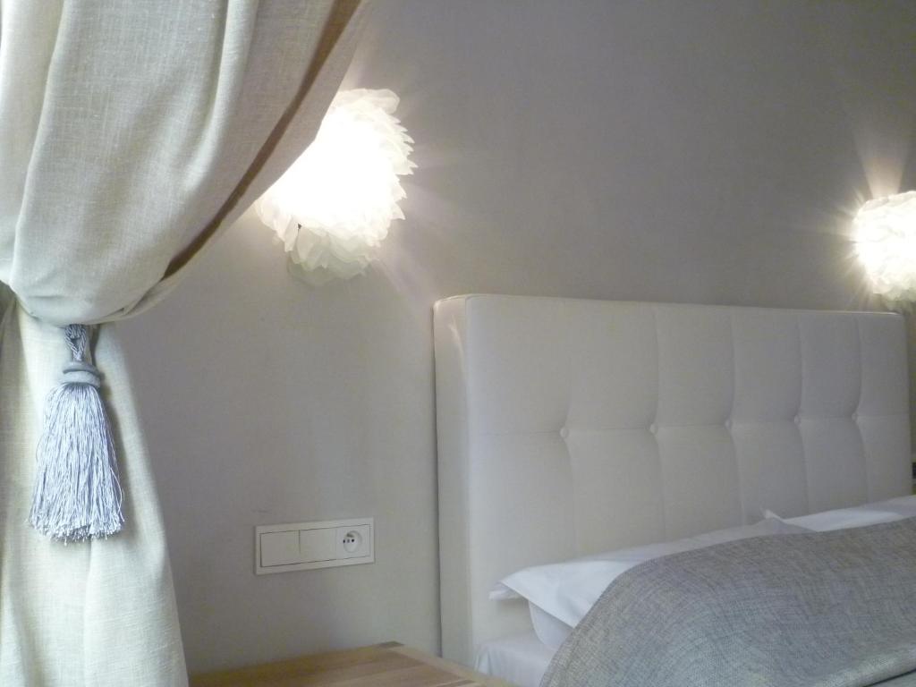 Postel nebo postele na pokoji v ubytování Hotel Rossetti