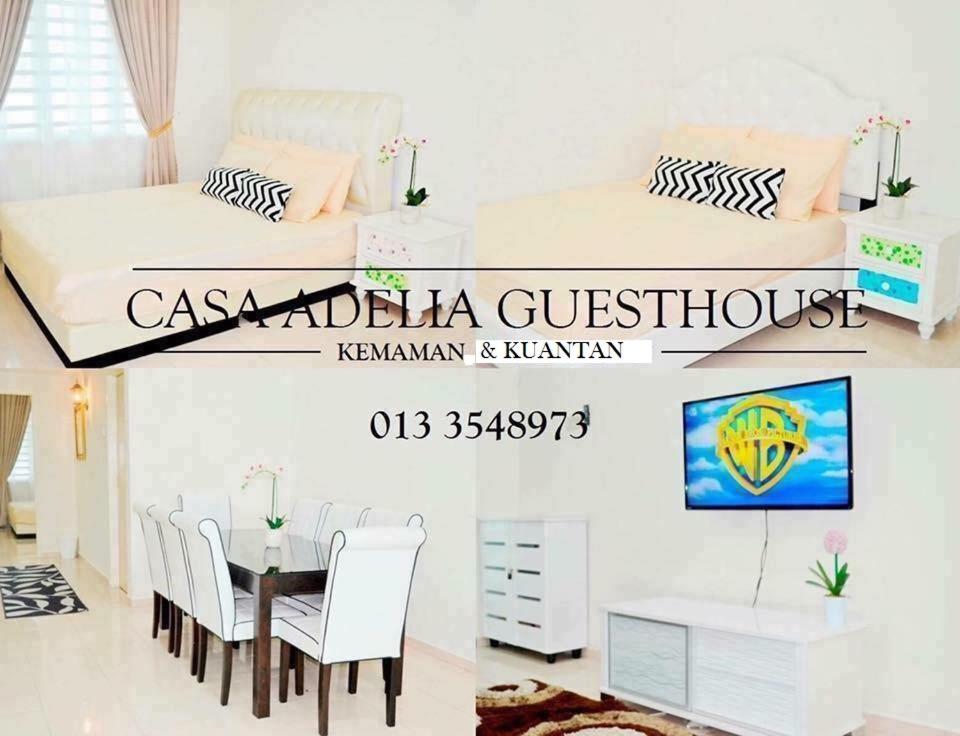 Habitación con cama, mesa y sillas. en CASA ADELIA HOMESTAY KEMAMAN, en Cukai