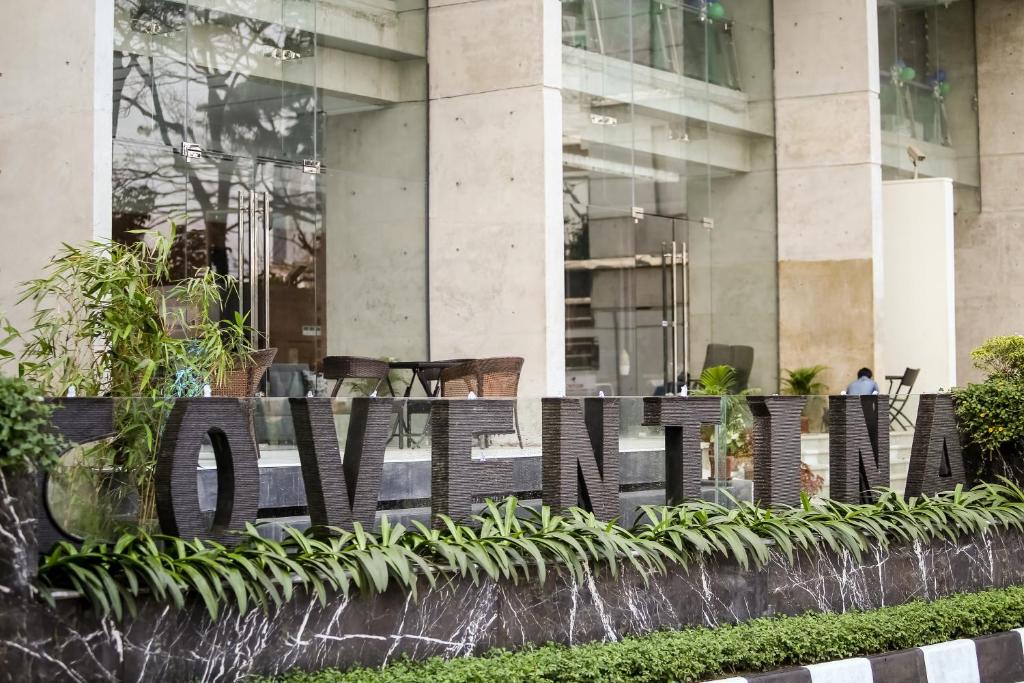 a sign that says vancouver in front of a building at Coventina Lake Suites in Dhaka