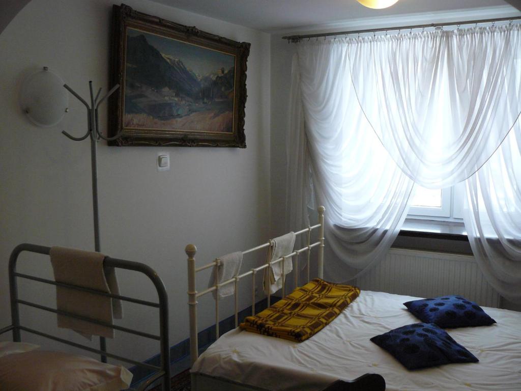 Postel nebo postele na pokoji v ubytování Piaseczno Willa Staropolska