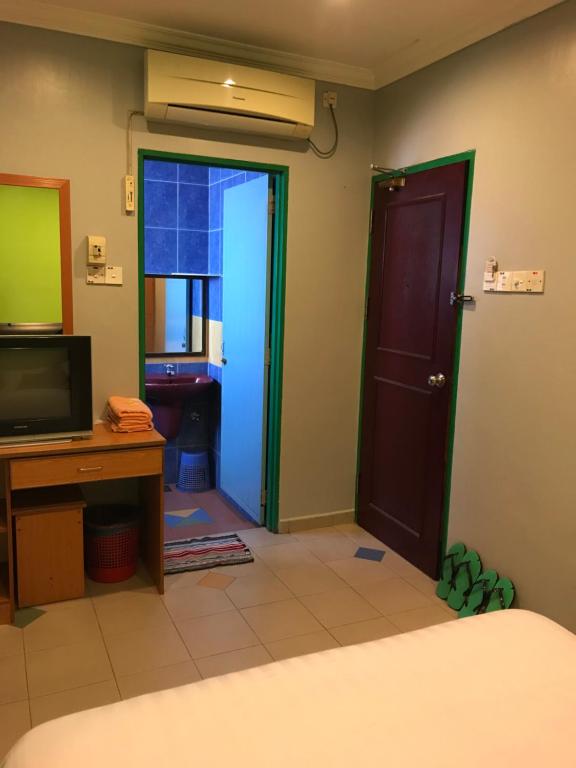 TV a/nebo společenská místnost v ubytování Kangsar Hotel