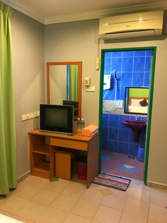 TV a/nebo společenská místnost v ubytování Kangsar Hotel