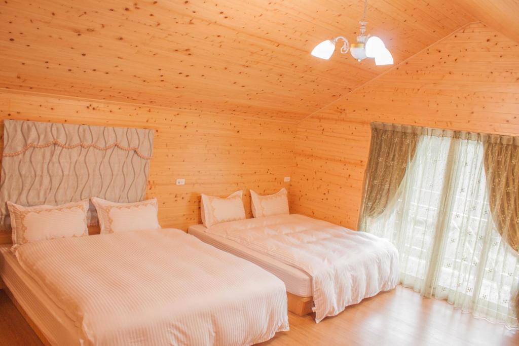 Postel nebo postele na pokoji v ubytování Xitou Star Homestay