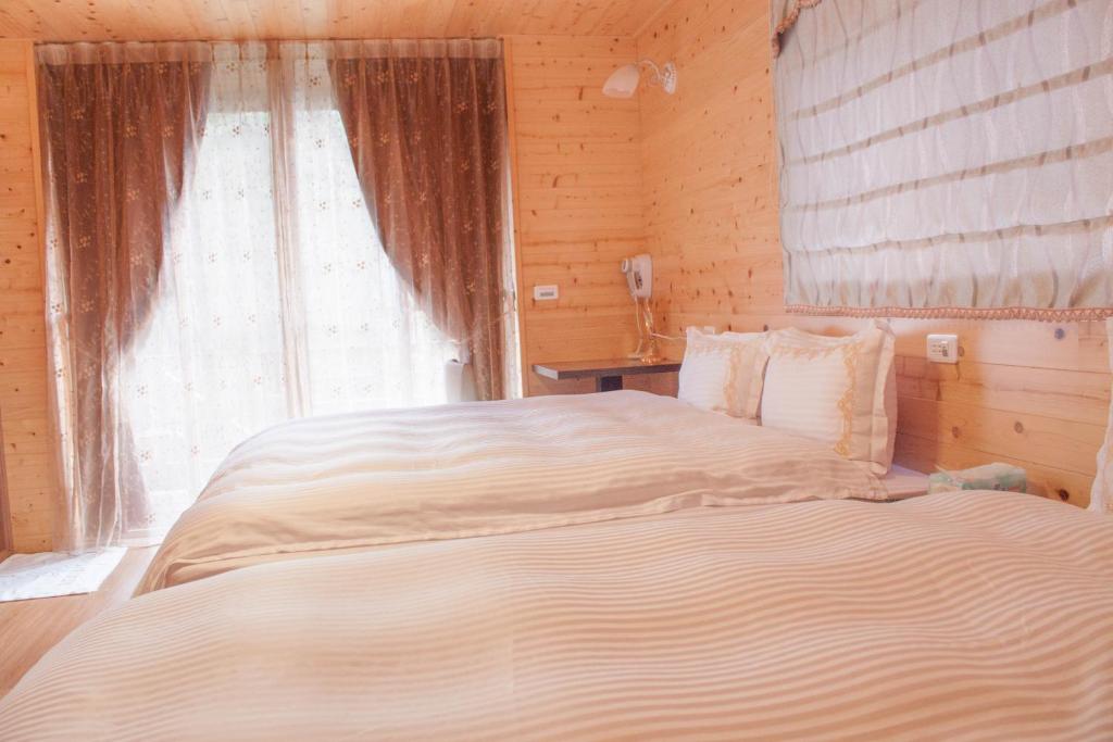 Postel nebo postele na pokoji v ubytování Xitou Star Homestay