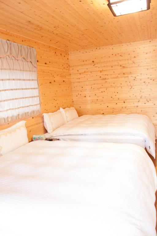 Postel nebo postele na pokoji v ubytování Xitou Star Homestay