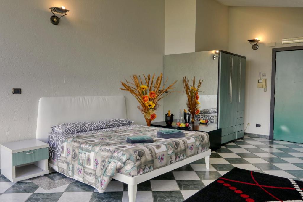 Postel nebo postele na pokoji v ubytování Hotel Residenza Delle Alpi