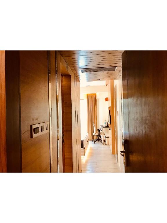 Postel nebo postele na pokoji v ubytování JRD Pride-Business Hotel