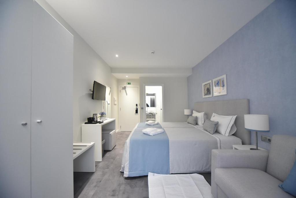 Postel nebo postele na pokoji v ubytování My Charm Lisbon Suites