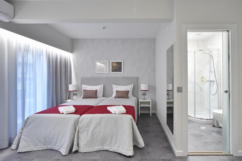 Postel nebo postele na pokoji v ubytování My Charm Lisbon Suites