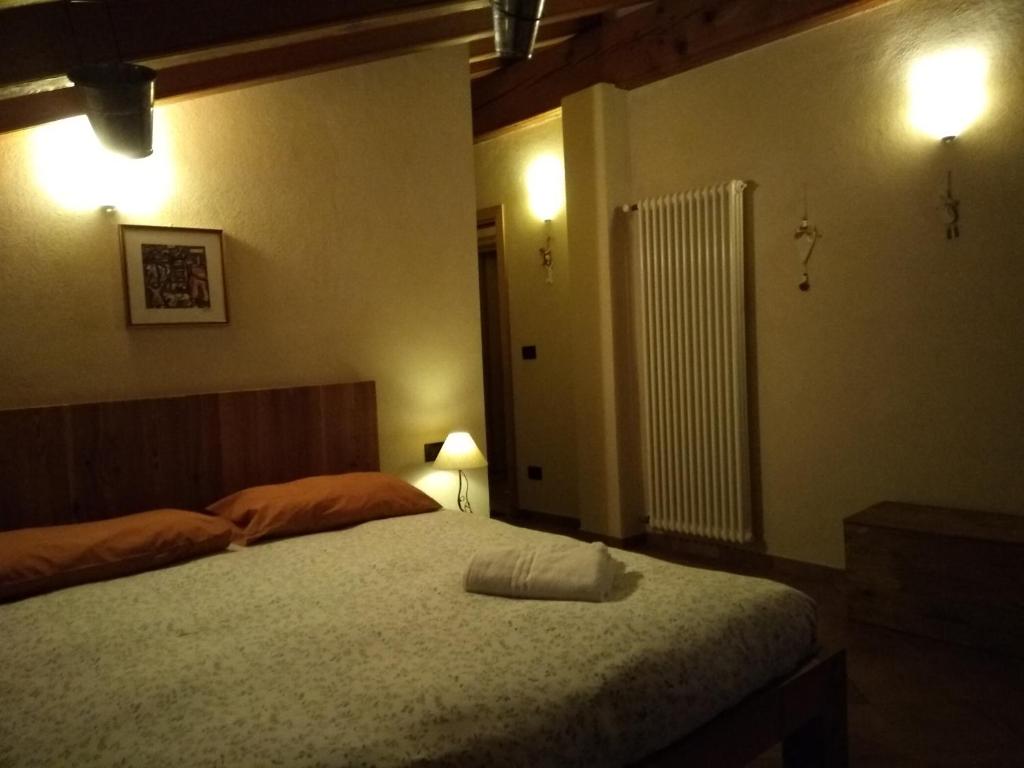 Posteľ alebo postele v izbe v ubytovaní Affittacamere I Picchi