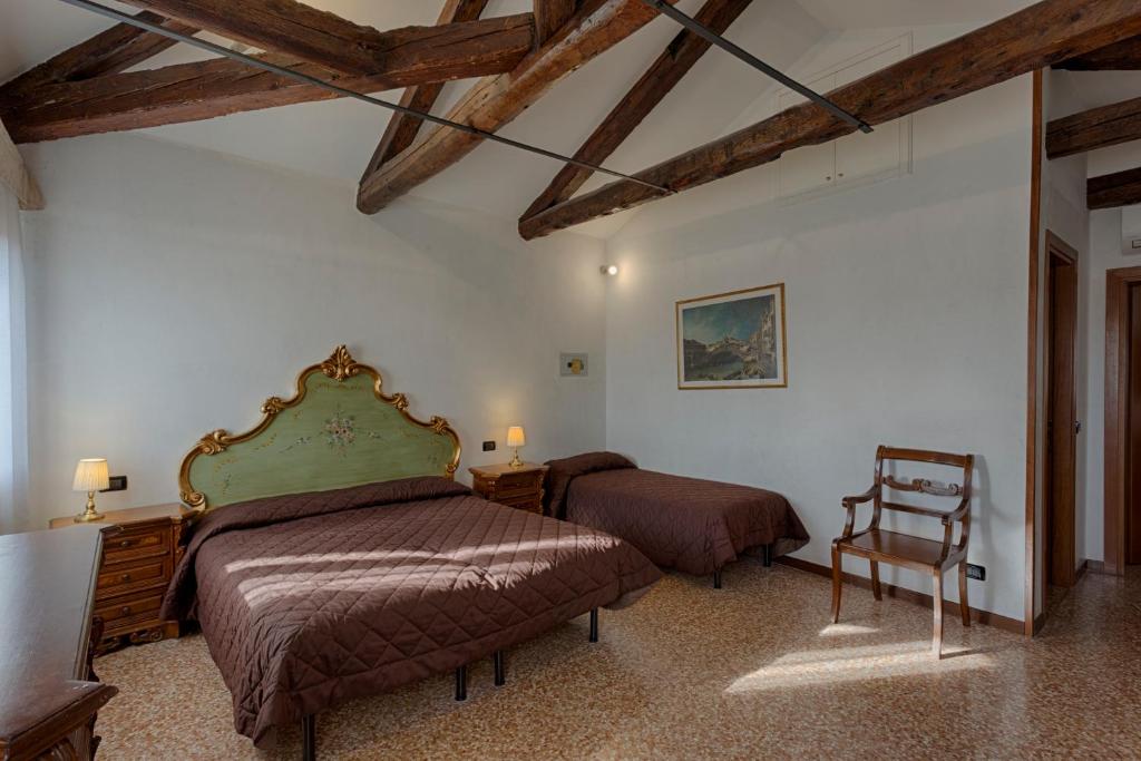 Postel nebo postele na pokoji v ubytování Hotel Guerrato