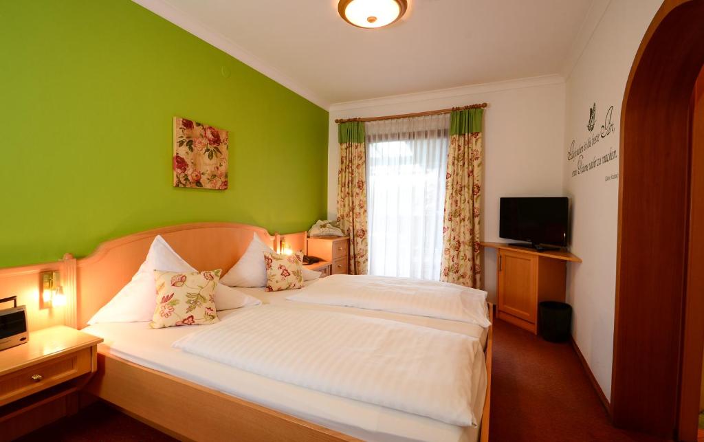 Postel nebo postele na pokoji v ubytování Hotel Kogler