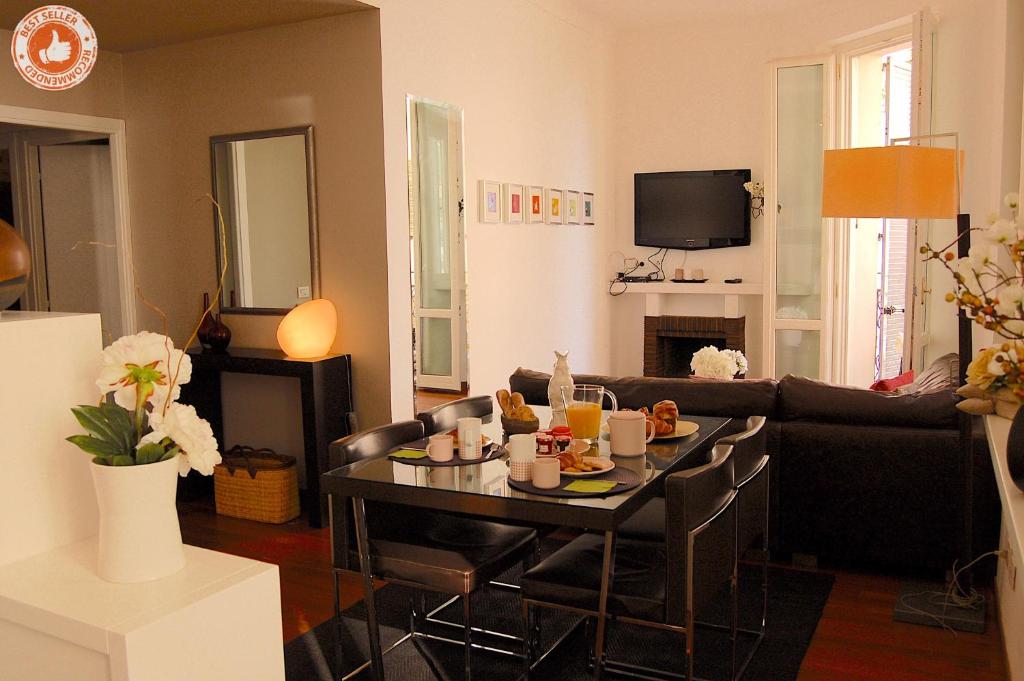 a living room with a table with food on it at ALC - VC2 - 7 min Palais and 3 min Beaches in Cannes