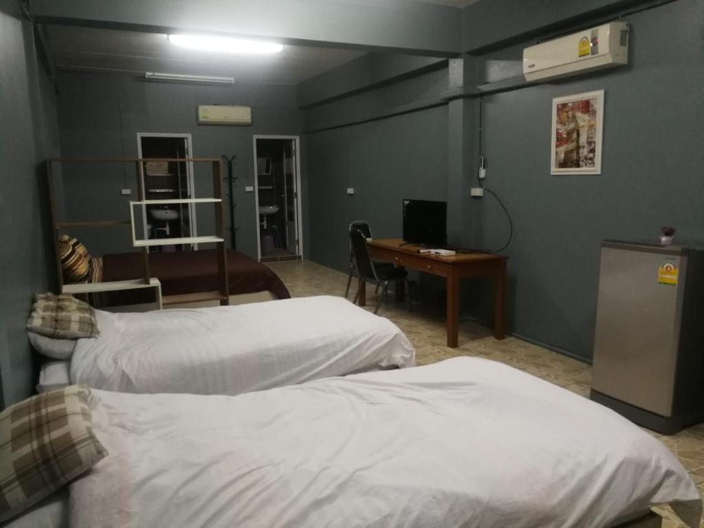 Postel nebo postele na pokoji v ubytování E2S Place