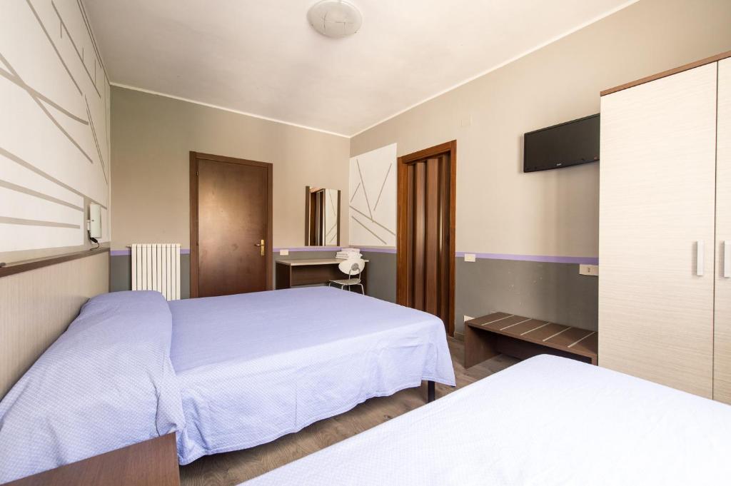 Postel nebo postele na pokoji v ubytování Hotel Terranova