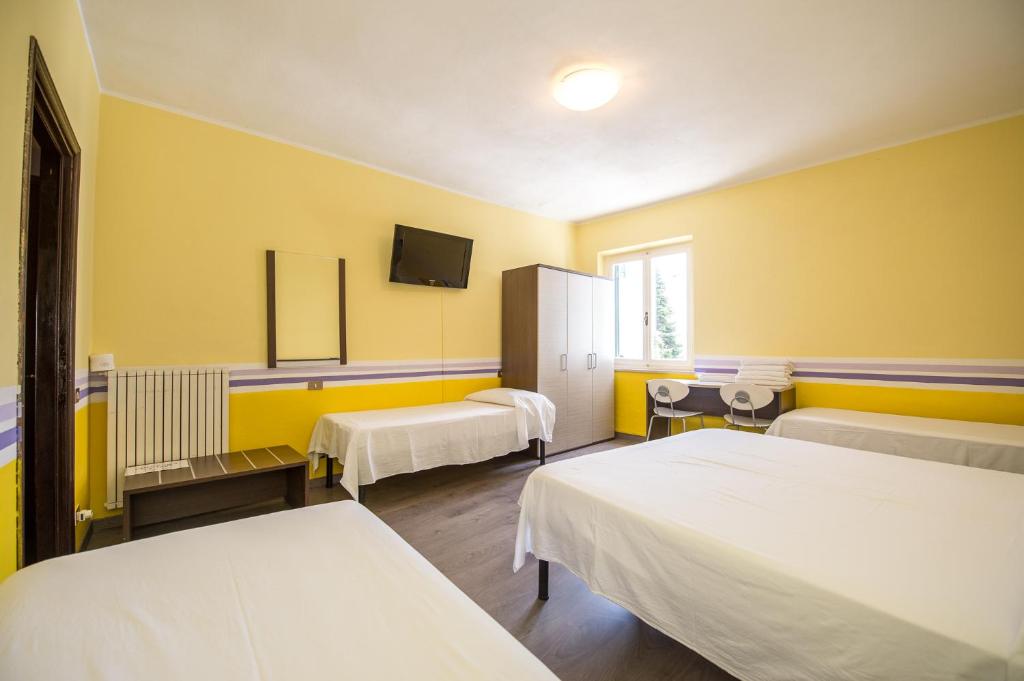 Postel nebo postele na pokoji v ubytování Hotel Terranova