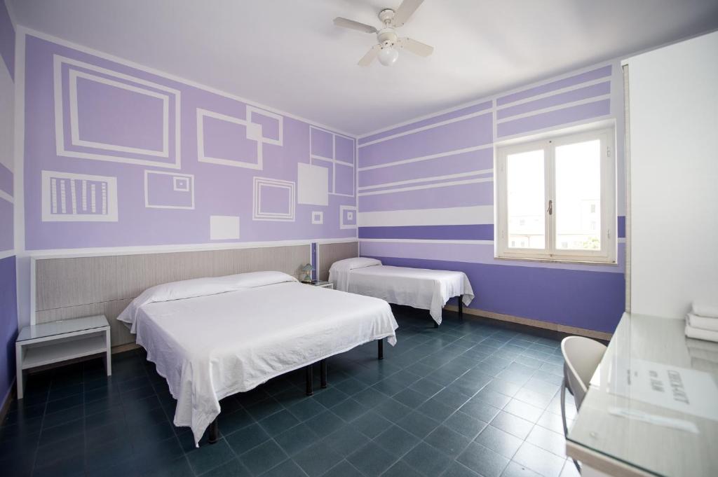 Postel nebo postele na pokoji v ubytování Hotel Terranova