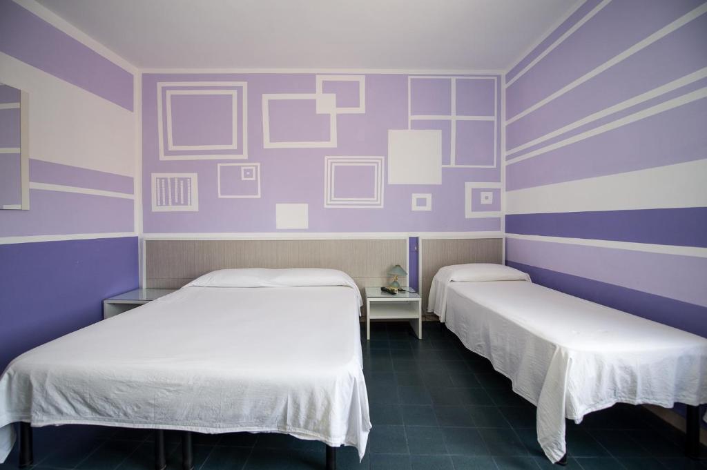 Postel nebo postele na pokoji v ubytování Hotel Terranova