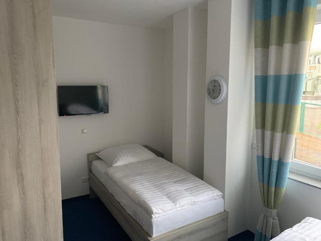Postel nebo postele na pokoji v ubytování Hotel Am Spielacker