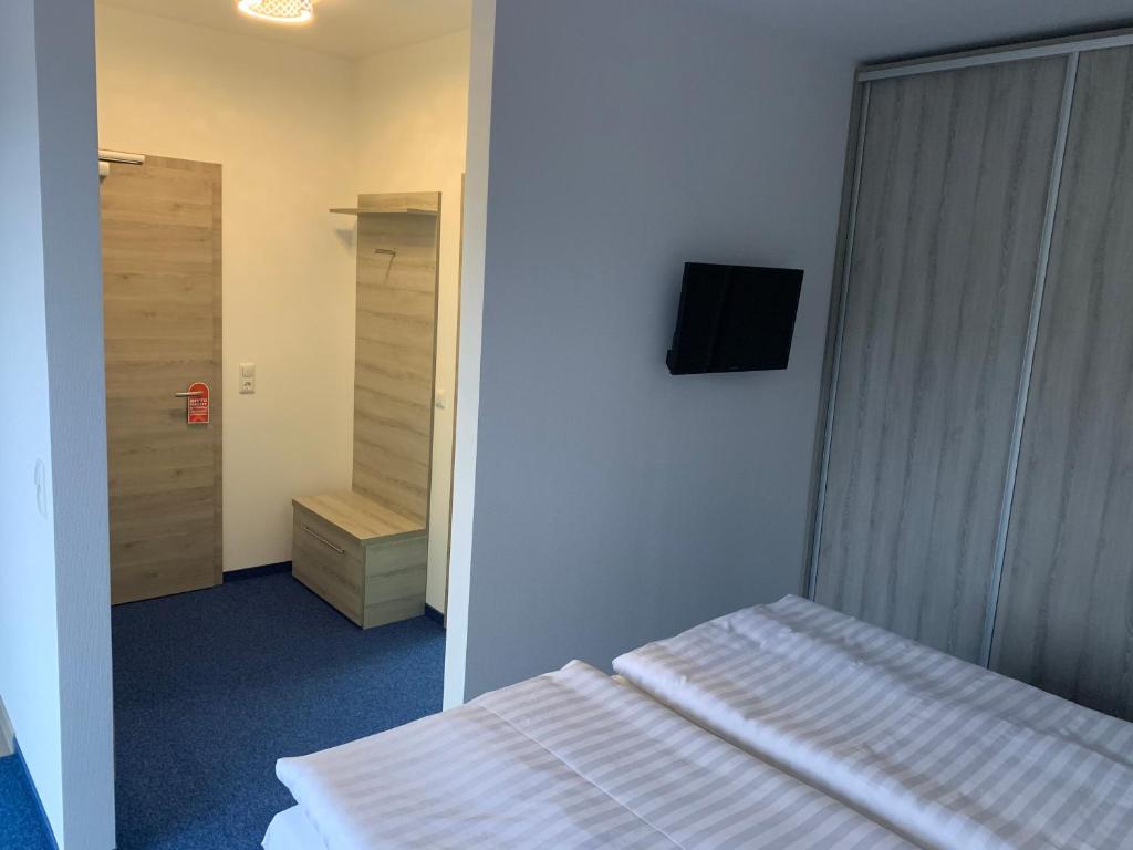 Postel nebo postele na pokoji v ubytování Hotel Am Spielacker