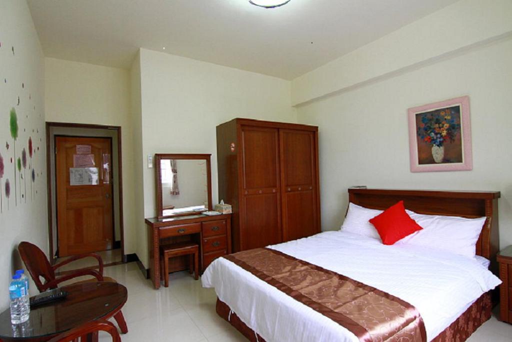 Postel nebo postele na pokoji v ubytování Shang Her Yuan B&B