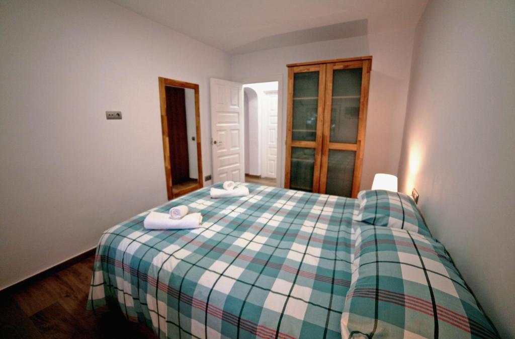 A bed or beds in a room at Apartamento 90 Toscamar