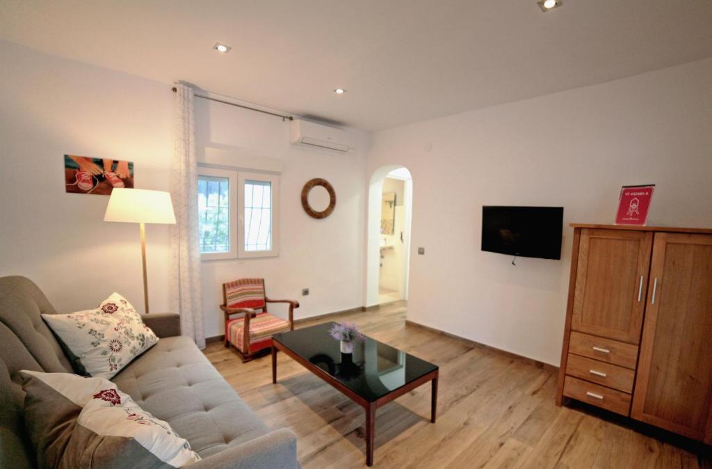 A television and/or entertainment centre at Apartamento 90 Toscamar