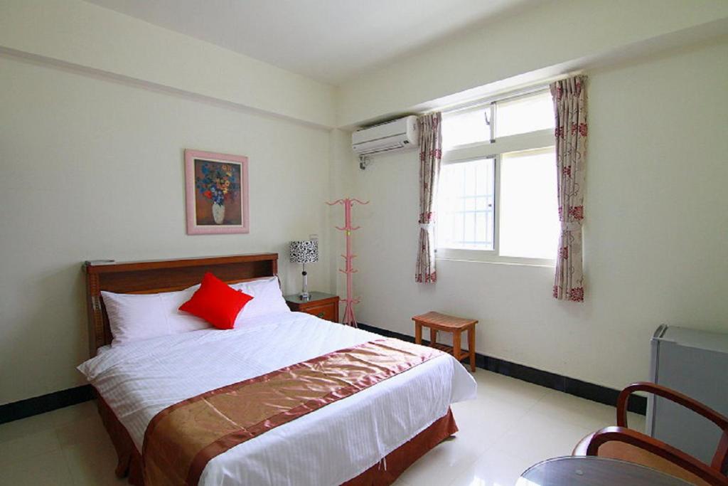 Postel nebo postele na pokoji v ubytování Shang Her Yuan B&B