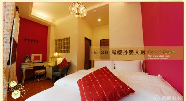 a hotel room with a bed and a dresser at Hsitou Man Tuo Xiang Homestay in Lugu Lake