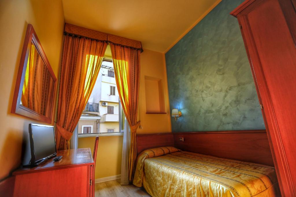 Postel nebo postele na pokoji v ubytování Hotel Giolitti