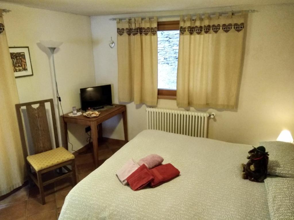 Posteľ alebo postele v izbe v ubytovaní Affittacamere I Picchi