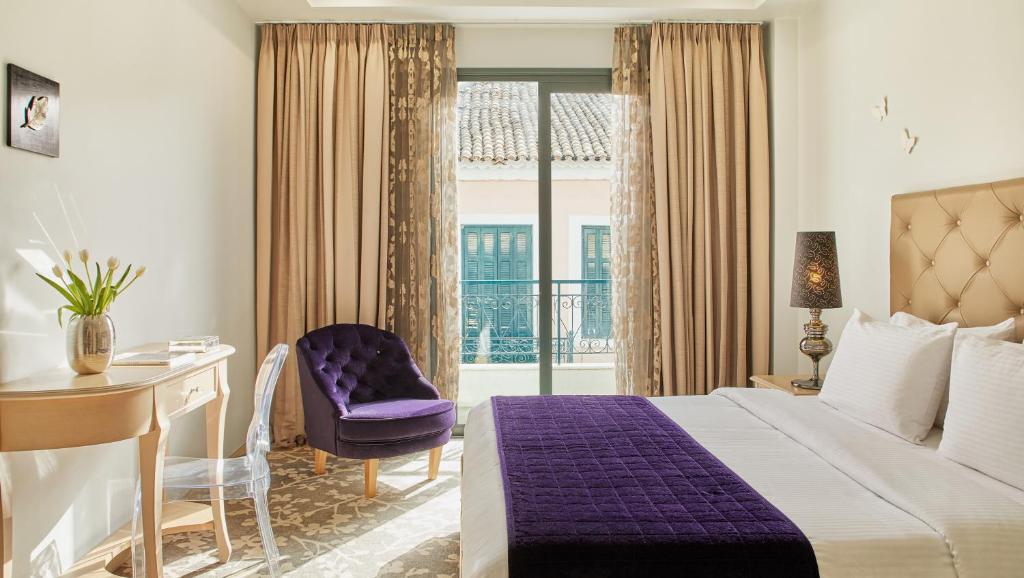 Postel nebo postele na pokoji v ubytování Dioni Boutique Hotel