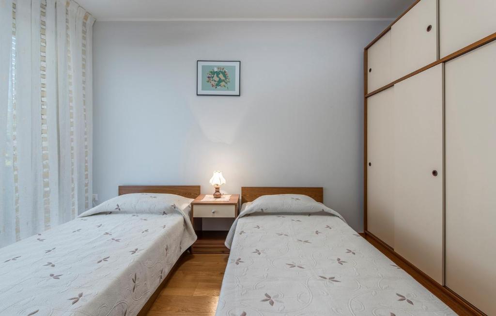 Postel nebo postele na pokoji v ubytování Apartment Complex Silvia